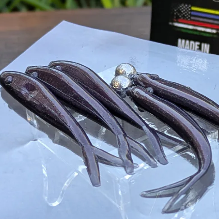 The dark beetle with purple flash creates strong contrast in murky water while mimicking a native beetle color with a minnow silhouette.